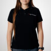 Polo team Core Line. Noir. Dames. Taille S.