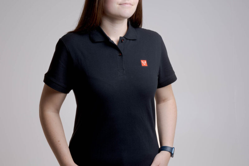 Polo Core Line. Noir. Dames. Taille L.