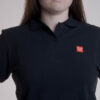 Polo Core Line. Noir. Dames. Taille L.