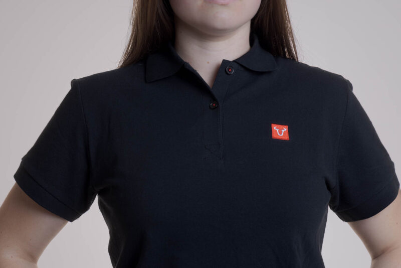 Polo Core Line. Noir. Dames. Taille L.